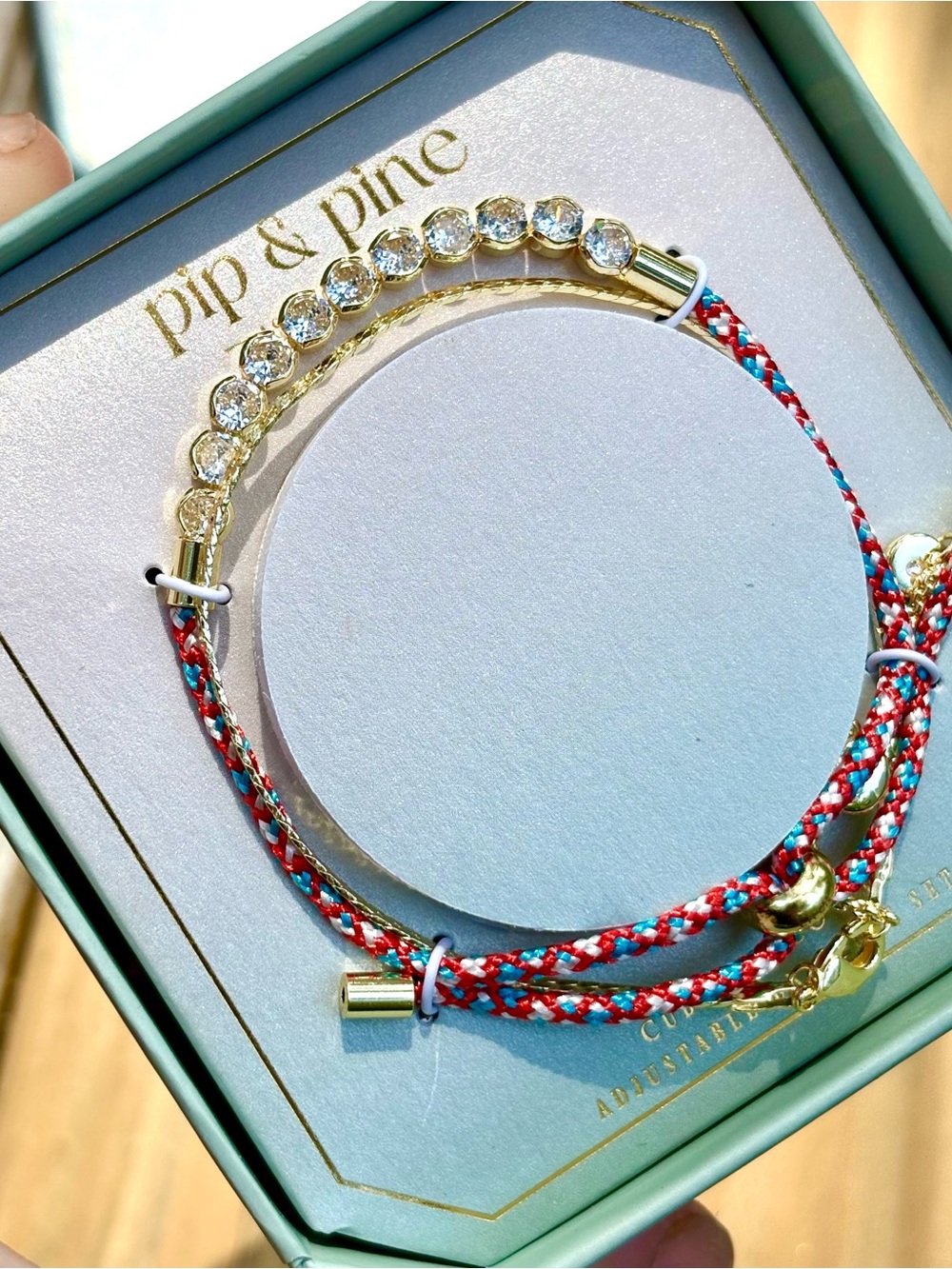 Pip & Pine Gold Crystal Bangle with Red and Turquoise Braided Cord